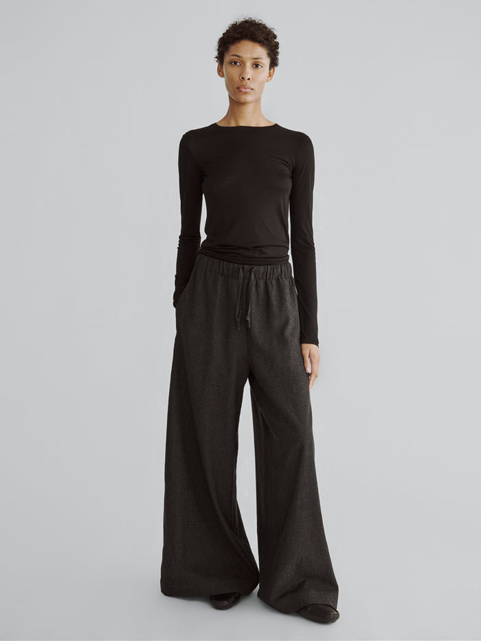 LAFINE Flowy Pants in Onyx wool. Designed by Yvonne Koné. Made in Italy.