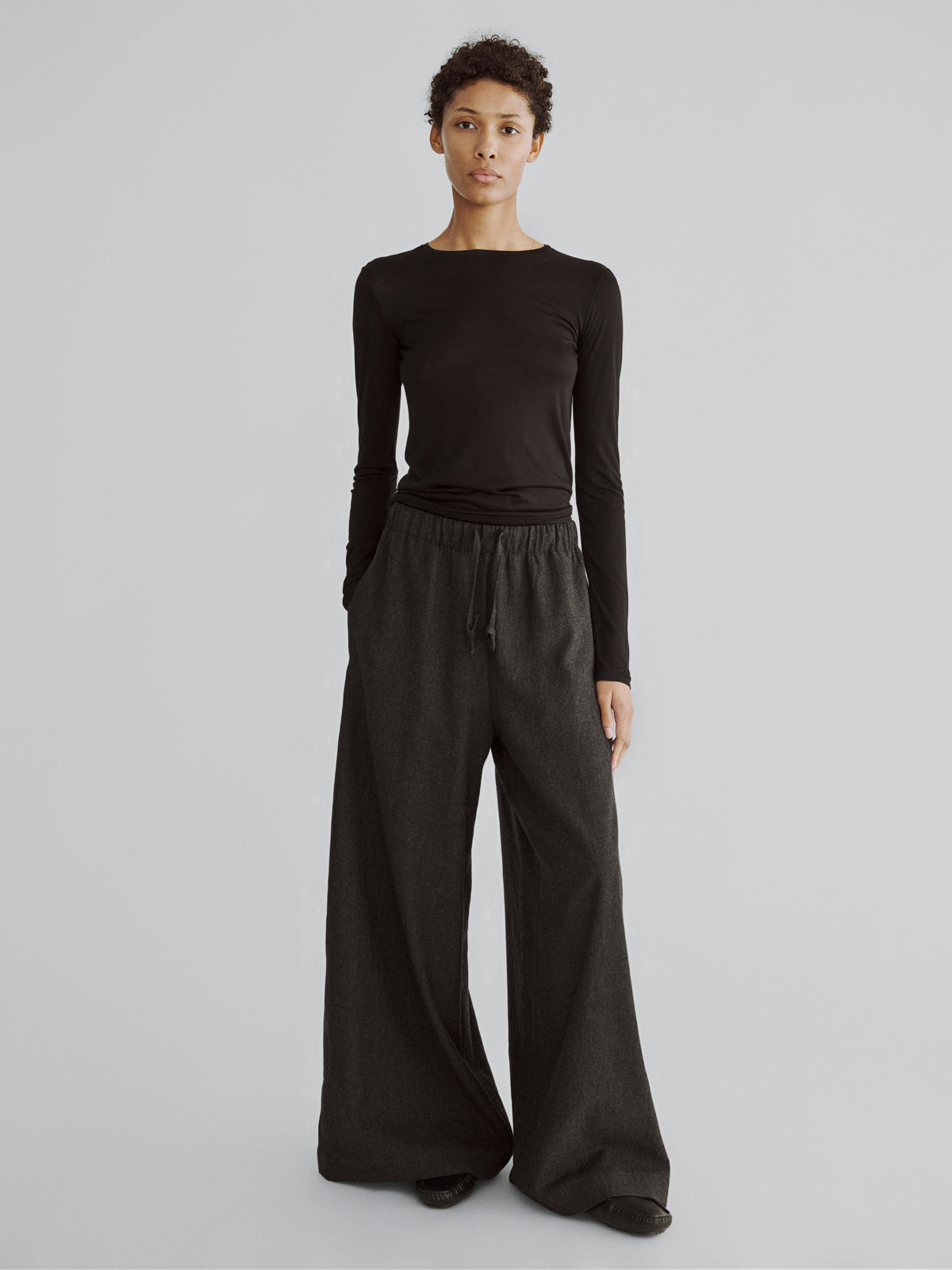 LAFINE Flowy Pants in Onyx wool. Designed by Yvonne Koné. Made in Italy.